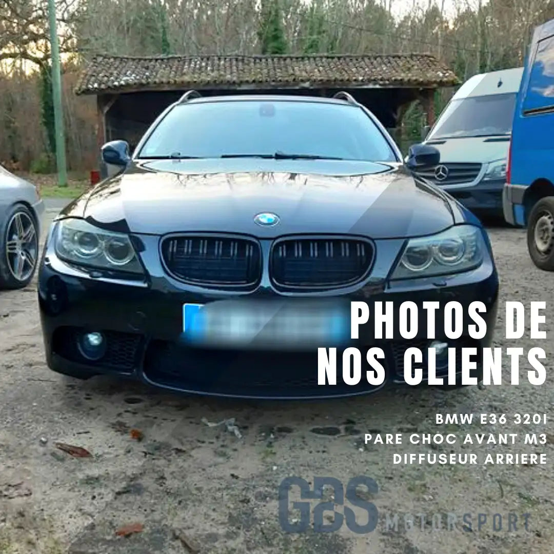 BMW E36 320i 2019 avec pare-chocs avant M3 et diffuseur arrière, noire.