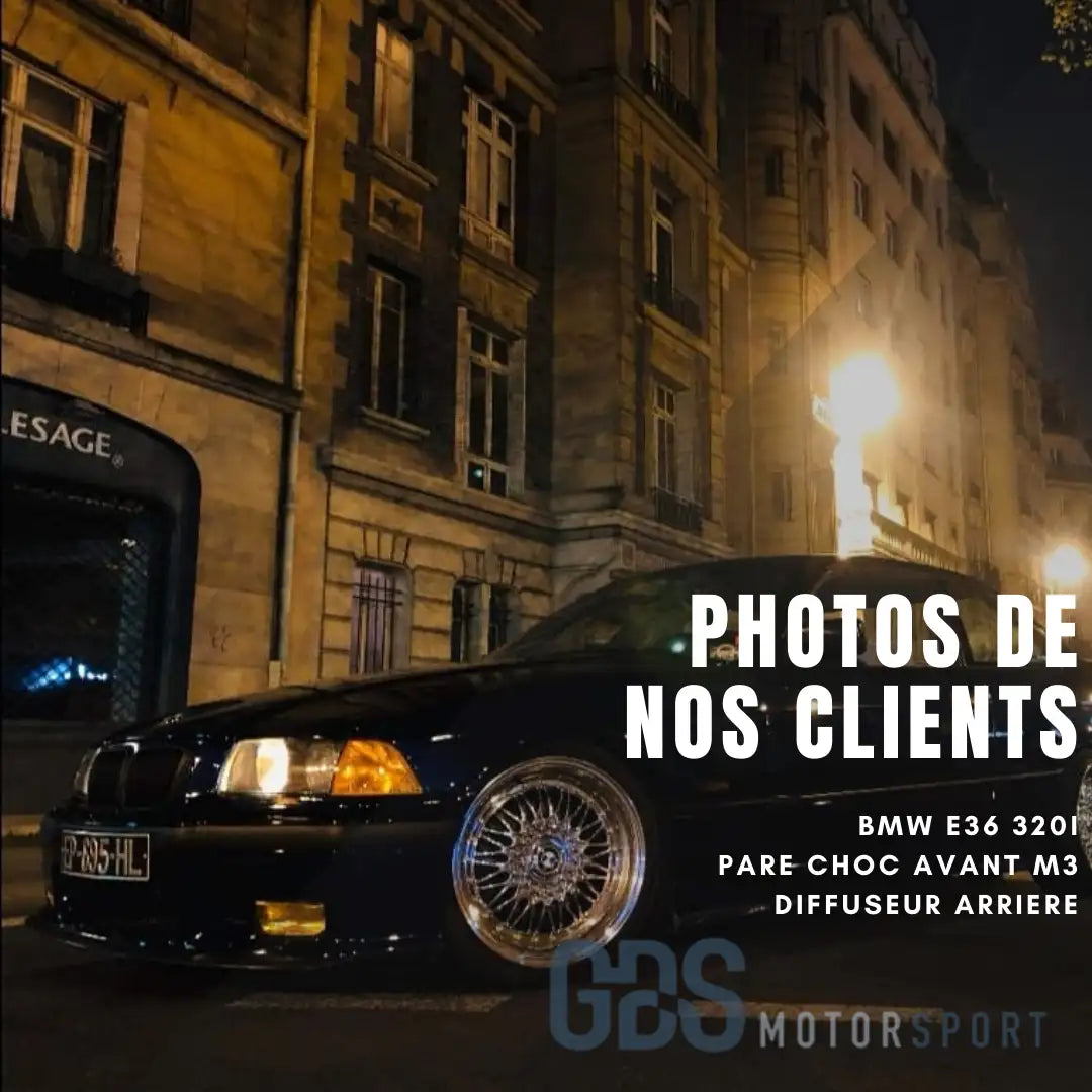 BMW E36 320i noire avec pare-chocs avant M3 et diffuseur arrière.